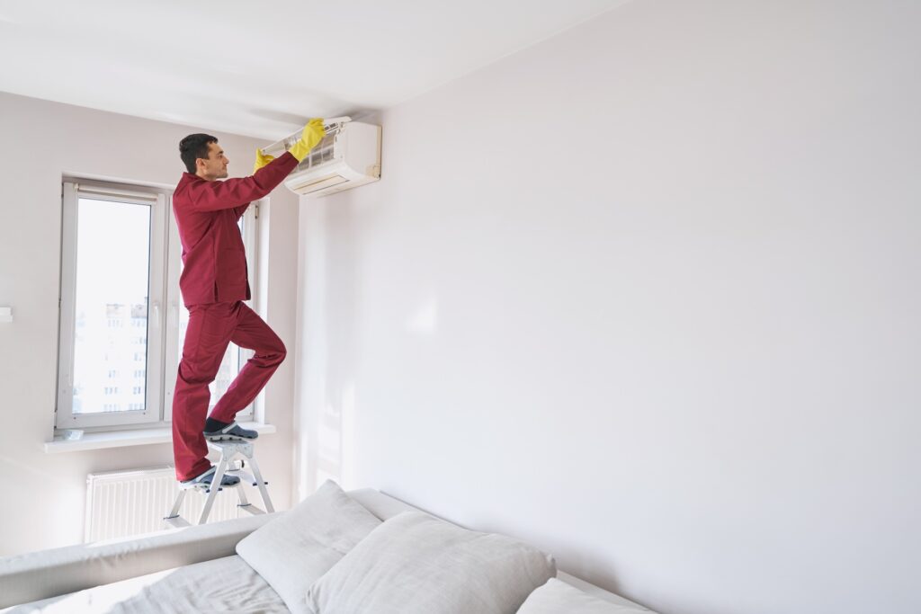 A Professional technician installing a new AC unit