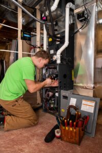 A professional technician installing a new Furnace system